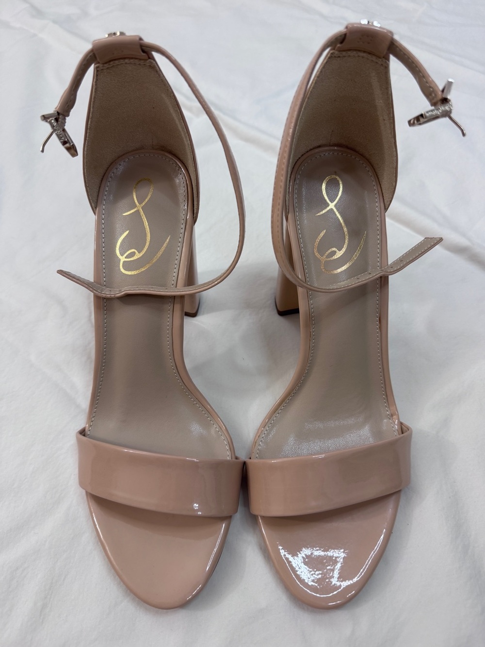Nude open toe patent leather heels